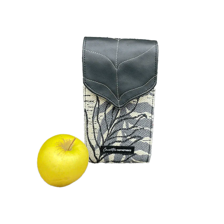 A companion made from a gray, navy blue, and yellow babywearing wrap with bird motifs and sun-yellow faux leather.