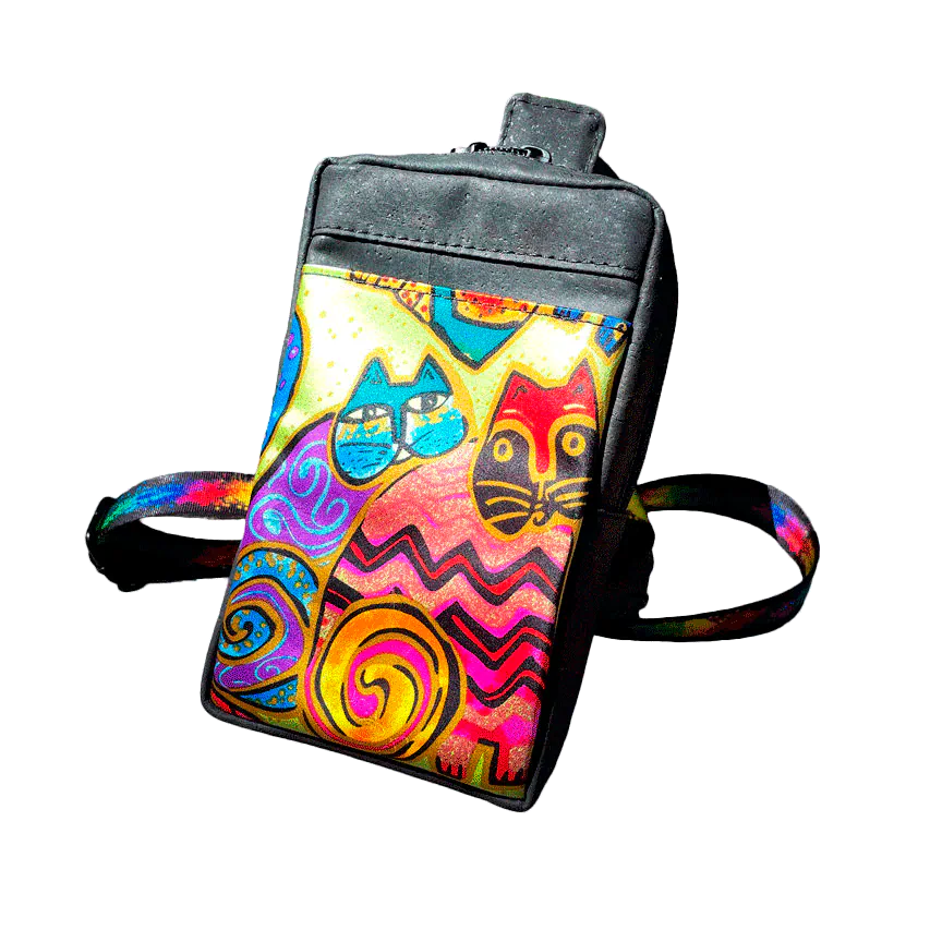 A small backpack made of matte black cork and a silk scarf with a colorful cat pattern, with a black and rainbow adjustable strap.