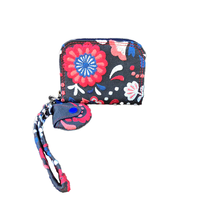 A small zippered card and coin holder made of gray fabric embroidered with blue, red, and white Scandinavian floral patterns.