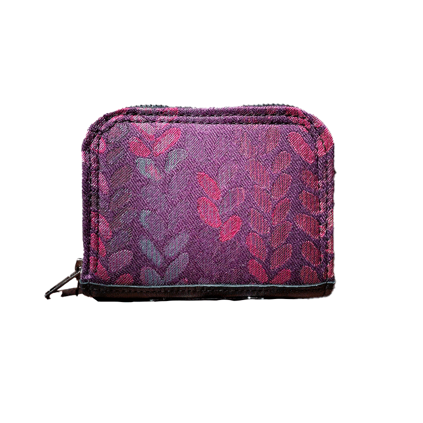A small zippered card and coin holder made of fabric in shades of purples, crimsons, pinks... with a droplet pattern.