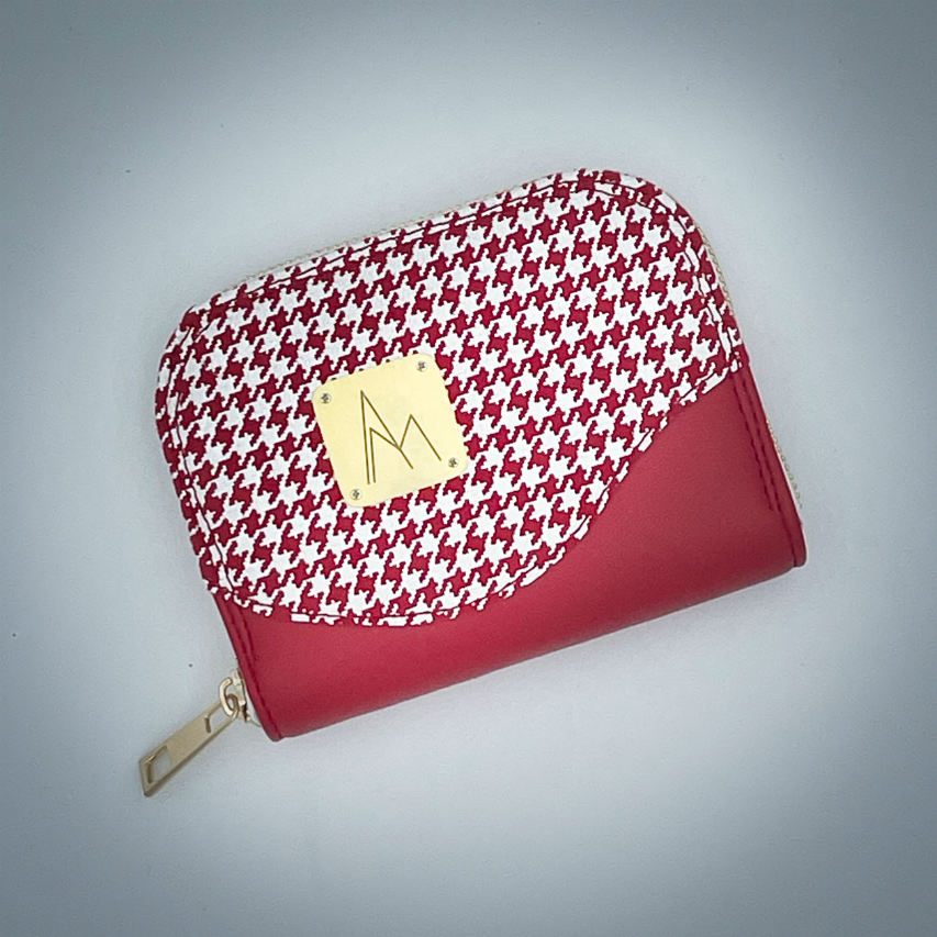 A zipped card-and-coin wallet made from red leather and a red leather printed with white houndstooth, with a red Sonia Rykiel branded lining.