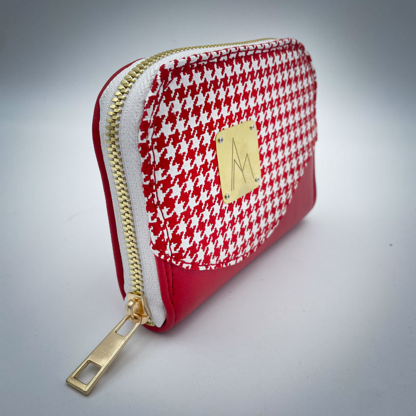 A zipped card-and-coin wallet made from red leather and a red leather printed with white houndstooth, with a red Sonia Rykiel branded lining.