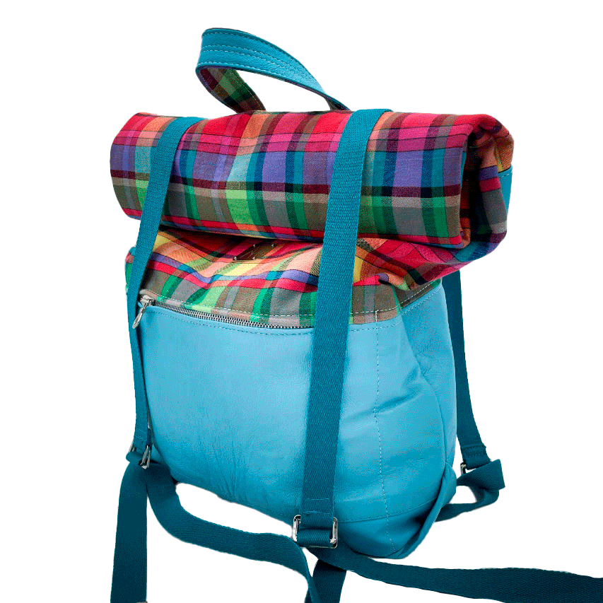 A rucksack made of light turquoise blue leather and multicolored Madras fabric.