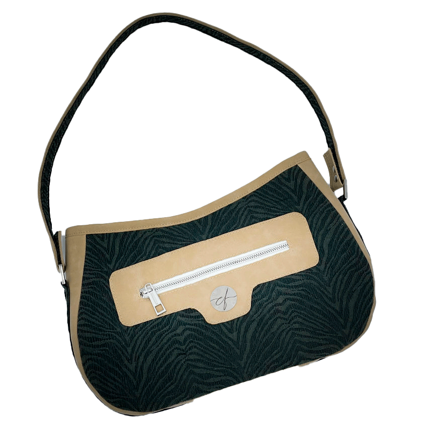 A shoulder bag made from a fabric with the pattern and texture of a forest green tiger fur paired with beige suede-like faux leather, and a lining composed of a high-fashion viscose with very small green and white gingham checks and a cream mottled linen sheet.