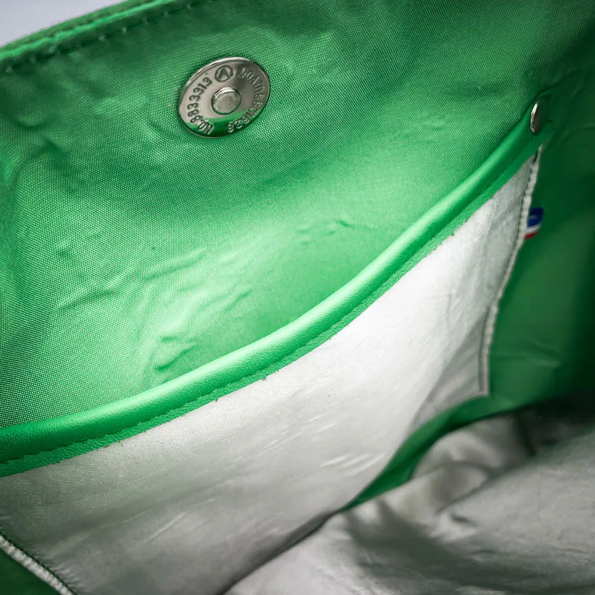 A shoulder bag in white and green leathers combined with a vintage green-and-white football jersey, and a white-and-green polyester satin lining.