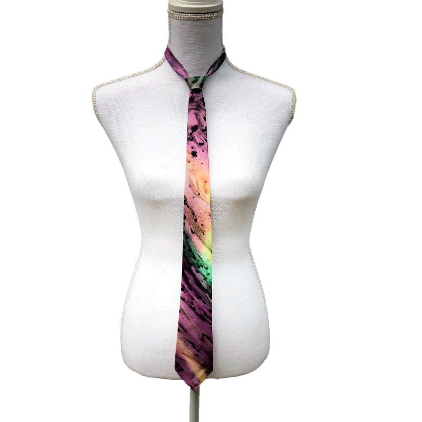 A tie made of blue, green, and purple silk chiffon, lined with taupe ramie.