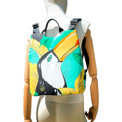 A backpack made of satin black leather, a parrot-patterned neck scarf, and black wool fabric.