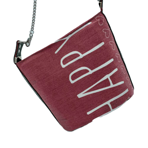 A small “bucket” bag made with delicate pink canvas featuring the word “Happy” and gray ostrich-patterned faux leather.