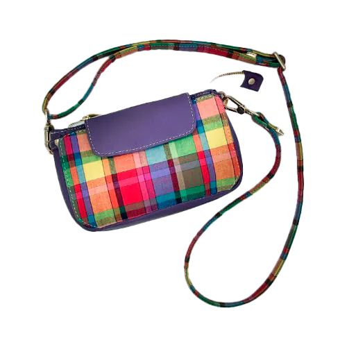A hybrid clutch wallet bag made of purple leather and multicolored madras fabric.