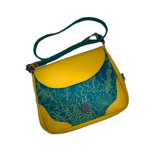 A messenger bag crafted from baby wrap fabric featuring yellow succulents on a turquoise background and sunshine-yellow leather, paired with ice-blue and yellow cotton linings inside.