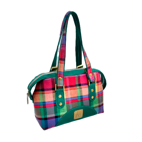 A wallet bag made of forest green leather and multicolored madras fabric.