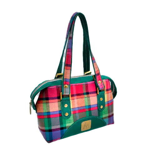 A wallet bag made of forest green leather and multicolored madras fabric.