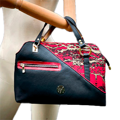 A handbag made of black, gold, and red faux leather and wrap fabric in the same tones, with a marbled pattern.