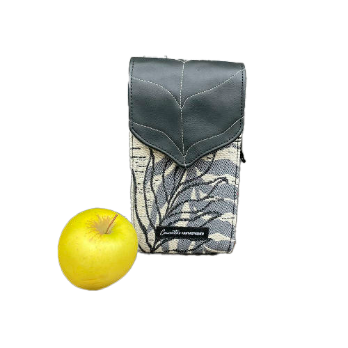 A companion made from a gray, navy blue, and yellow babywearing wrap with bird motifs and sun-yellow faux leather.