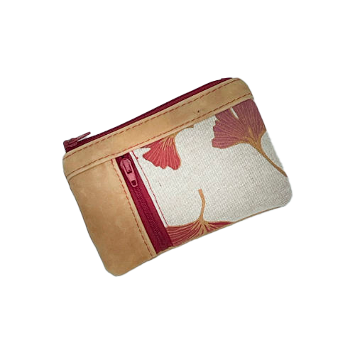 A mini zippered coin purse made of camel colored leather and a red Ginkgo Biloba leaves patterned polycotton canvas.