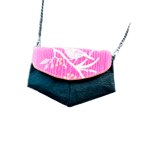 A small pouch made of pineapple-based faux leather in black and a pink, white, and yellow wrap fabric.