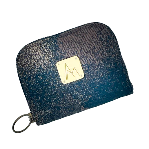 A small zippered card and coin wallet made with black, brown, and beige babywearing fabric featuring an abstract round pattern.