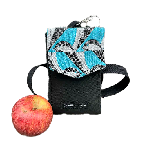 A phone-purse made from a gray, navy blue, and yellow babywearing wrap with bird motifs, and sun-yellow faux leather.