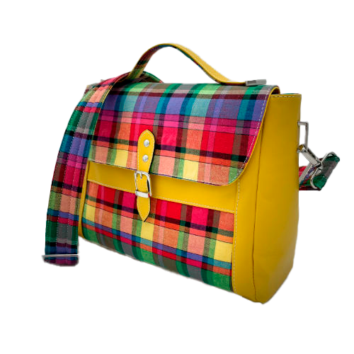 A satchel made of blood-red faux leather and multicolored madras fabric.