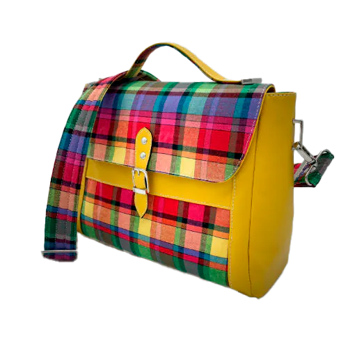 A satchel made of blood-red faux leather and multicolored madras fabric.