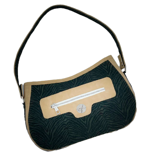 A shoulder bag made from a fabric with the pattern and texture of a forest green tiger fur paired with beige suede-like faux leather, and a lining composed of a high-fashion viscose with very small green and white gingham checks and a cream mottled linen sheet.