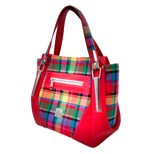A shoulder bag made of blood-red faux leather and multicolored madras fabric.