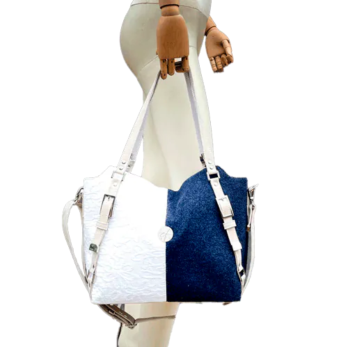 A shoulder bag made from navy wool and white cotton damask.
