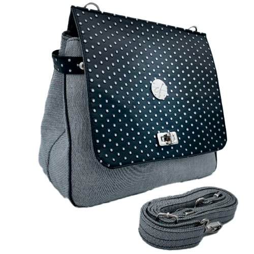 A boxy bag made with a silver dotted black vinyl and grey couture denim.
