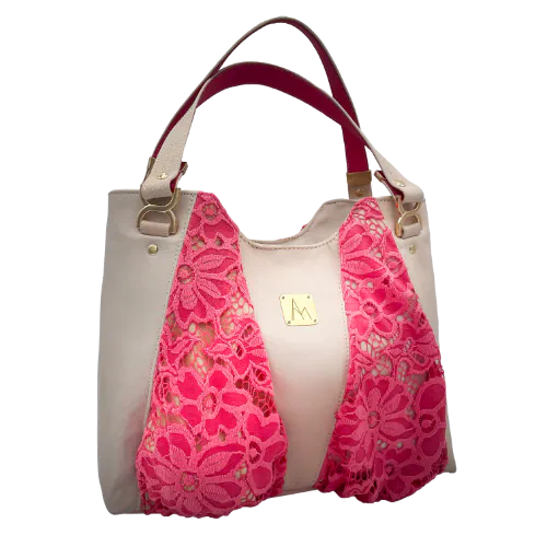A shoulder bag made of beige goat leather, coral pink lace, and a mouse-gray lining.