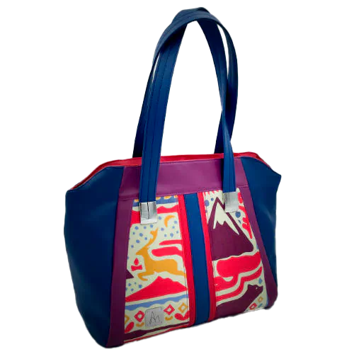 A shoulder bag made from a silk scarf with Scandinavian folklore patterns, combined with red, blue, and purple faux leathers.