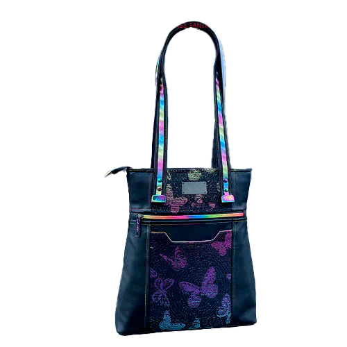 Two-tone/two-material handles, luxury rainbow-colored hardware, velvety upcycled synthetic leather, and a playful babywearing fabric coupon with a whimsical pattern.