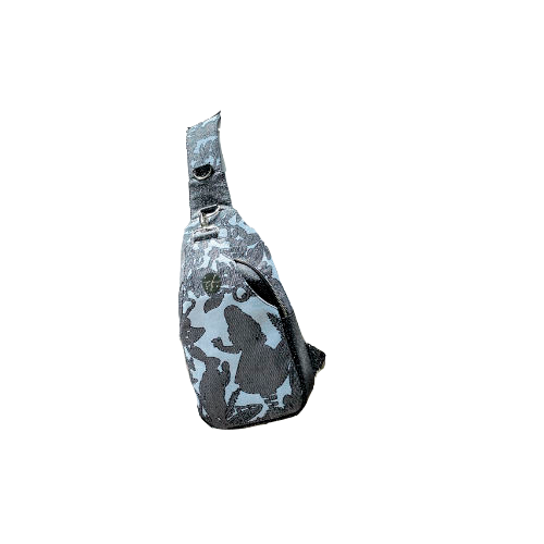A backpack made from multicolored glitter canvas and a gray-blue, black, and silver-glitter woven wrap with a motif inspired by the Alice in Wonderland story.
