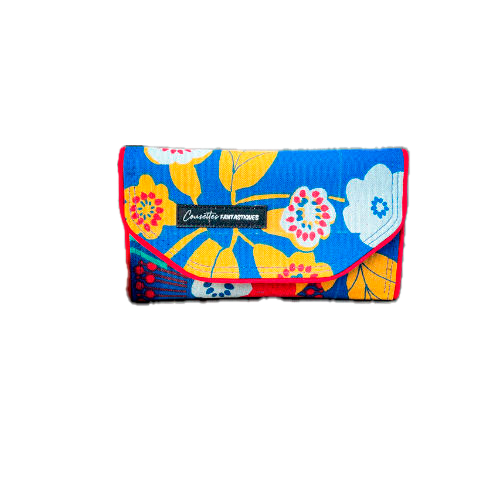 A wallet made from royal blue fabric with yellow, white, and red floral patterns on the outside and plain yellow and red fabrics on the inside.