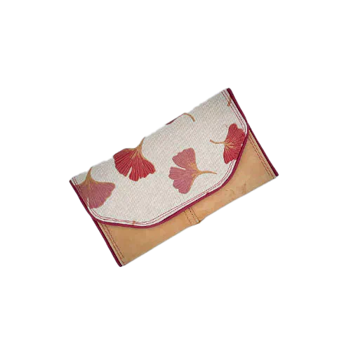 A wallet made from camel colored leather and a red Ginkgo Biloba leaves patterned polycotton canvas.