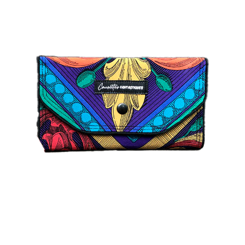 A wallet made from black and white floral silk chiffon on the outside and black poplin on the inside.