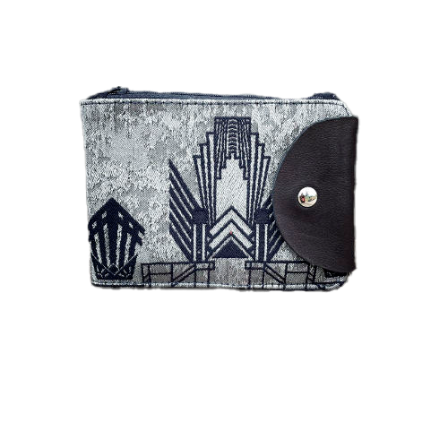 A wallet made from a midnight blue and silver geometric Art Deco patterned babywearing wrap, in midnight blue leather, midnight blue gabardine, and mouse gray poplin.
