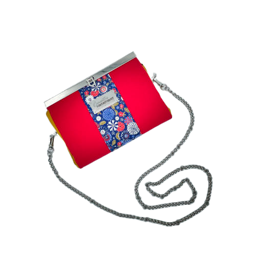 A companion made of solid red, solid yellow, and Japanese-inspired floral fabric in blue, white, red, and golden yellow.