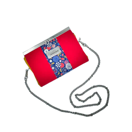 A companion made of solid red, solid yellow, and Japanese-inspired floral fabric in blue, white, red, and golden yellow.