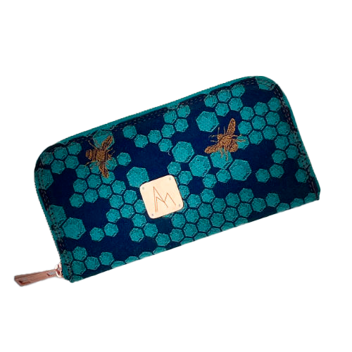 A zippered card and coin holder made with dark blue and petrol blue honeycomb patterned babywearing wrap fabric with bees.
