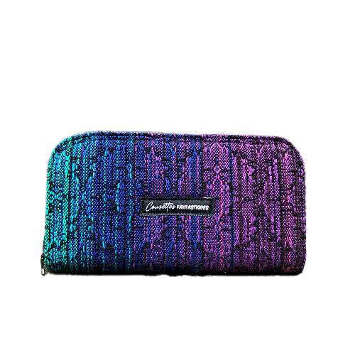 A wallet made with a babywearing wrap in a gradient from blue to violet on the outside and black, pink, and petrol poplin on the inside.