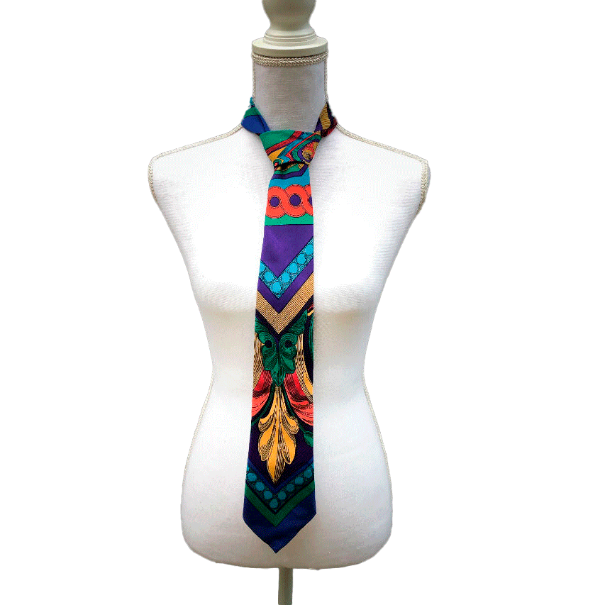 A tie made from black and gold woven wrap, marbled pattern.
