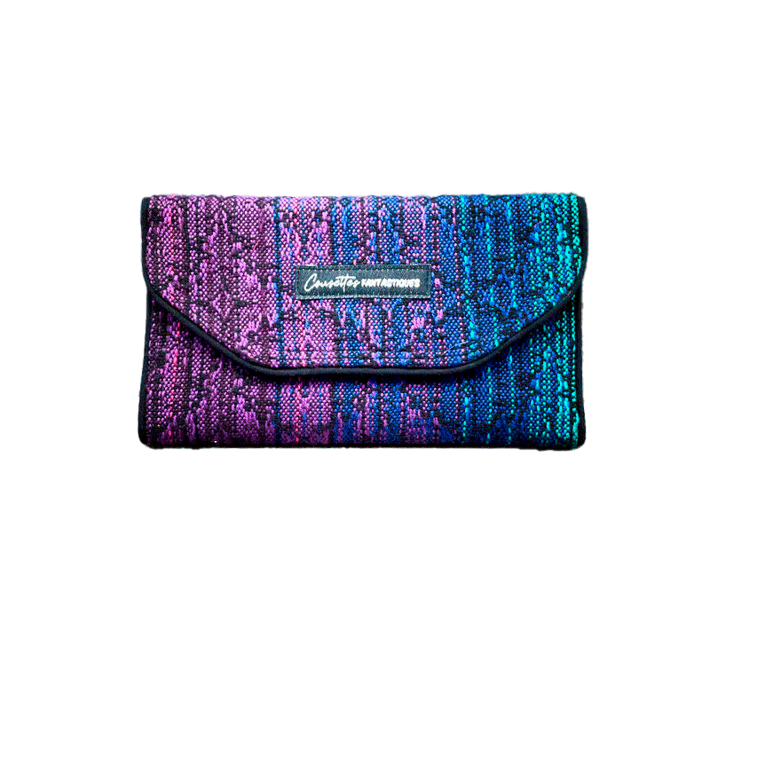 A wallet made from a gradient blue to violet babywearing wrap on the outside and purple voile on the inside.