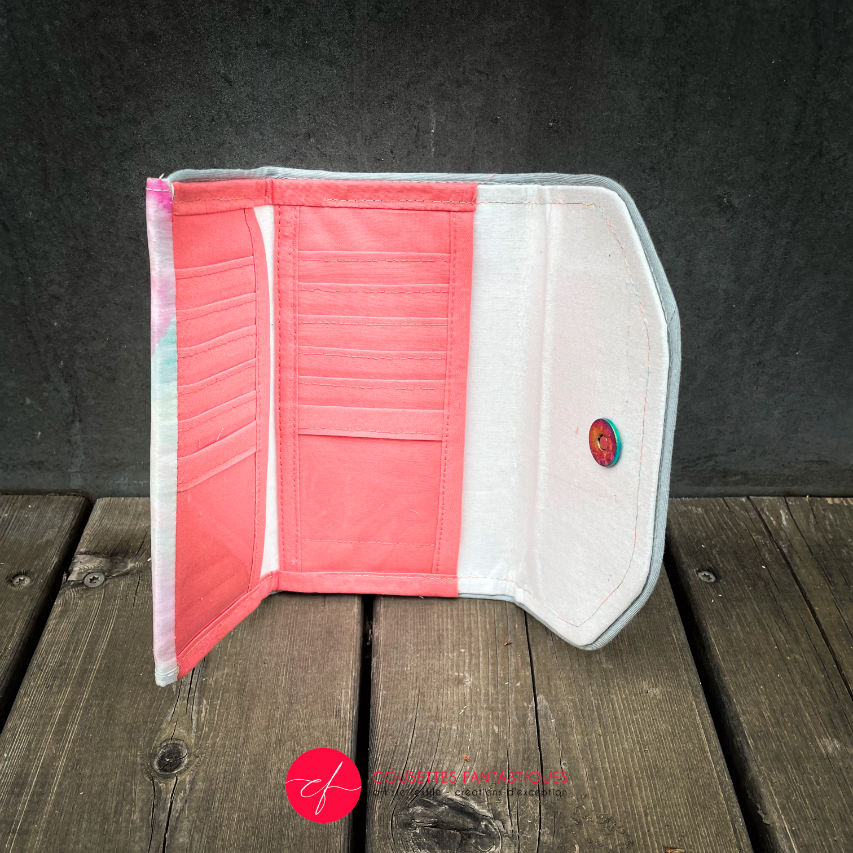 A wallet made from a hand-painted silk scarf and bubblegum pink poplin.