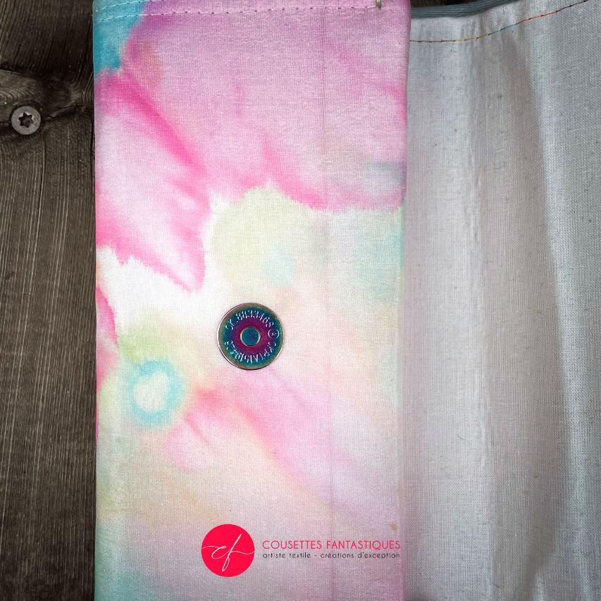 A wallet made from a hand-painted silk scarf and bubblegum pink poplin.