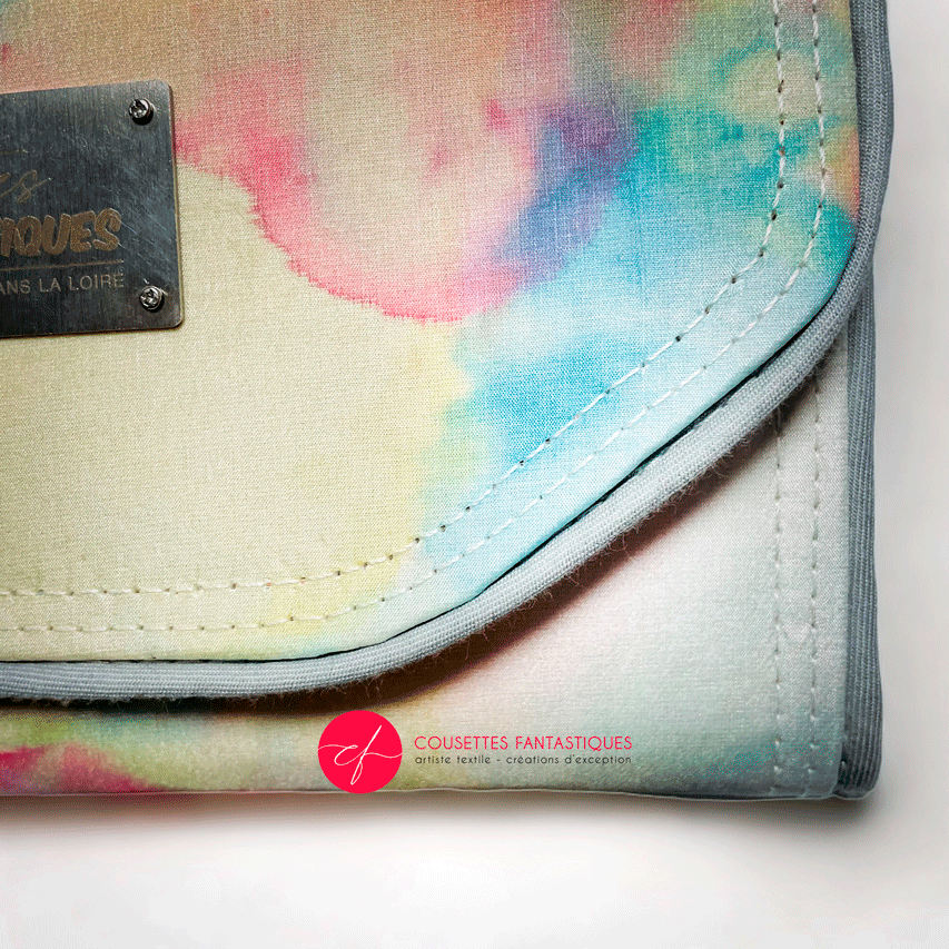 A wallet made from a hand-painted silk scarf and bubblegum pink poplin.