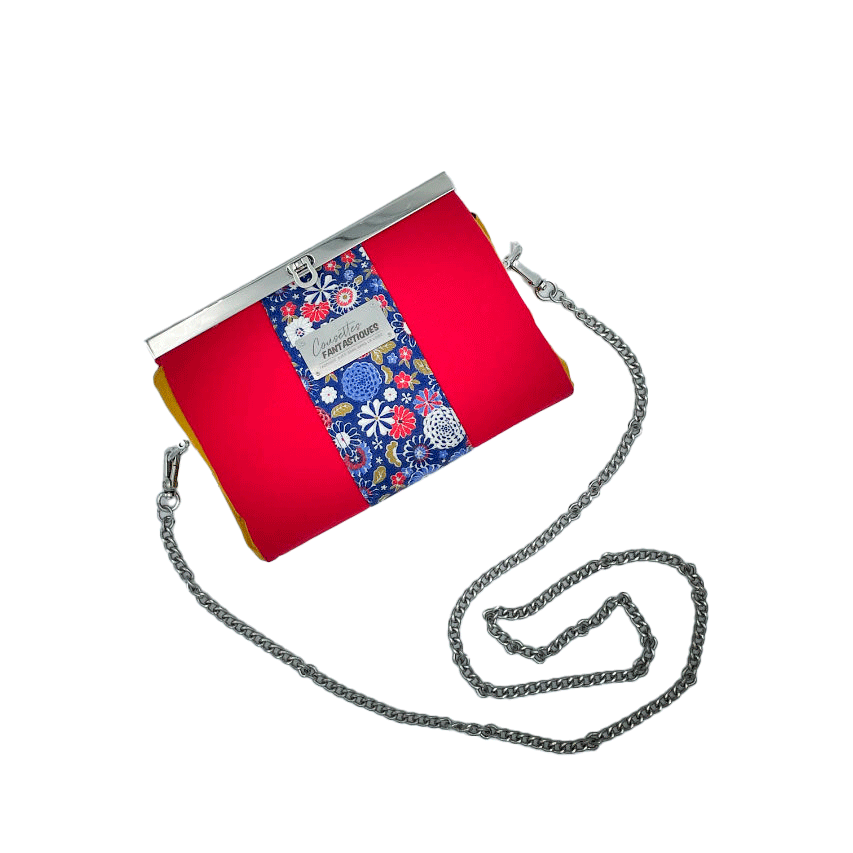 A companion made of solid red, solid yellow, and Japanese-inspired floral fabric in blue, white, red, and golden yellow.