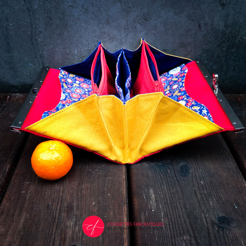 A companion made of solid red, solid yellow, and Japanese-inspired floral fabric in blue, white, red, and golden yellow.