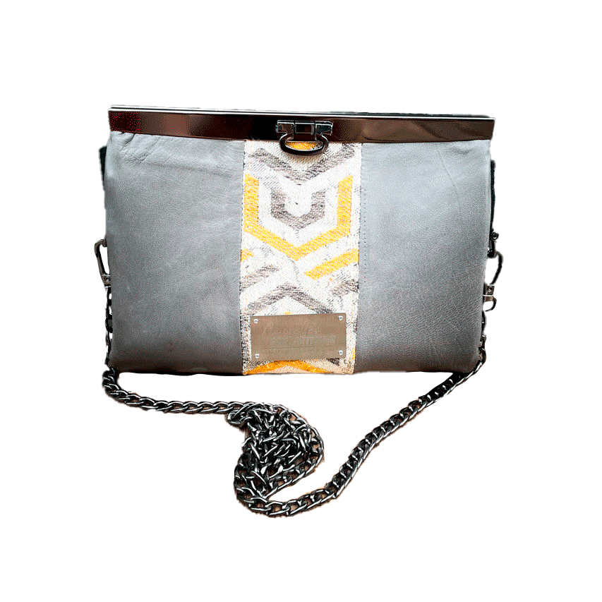 A companion made from a gray, mustard, and ecru babywearing wrap with geometric patterns and gray lambskin leather.