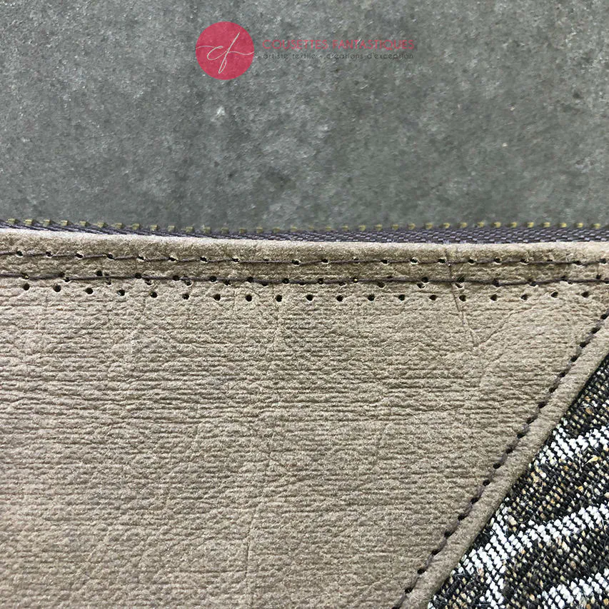 A zipped wallet and cardholder made of chocolate brown washable paper, baby wrap fabric in brown and beige tones, and yellow poplin.