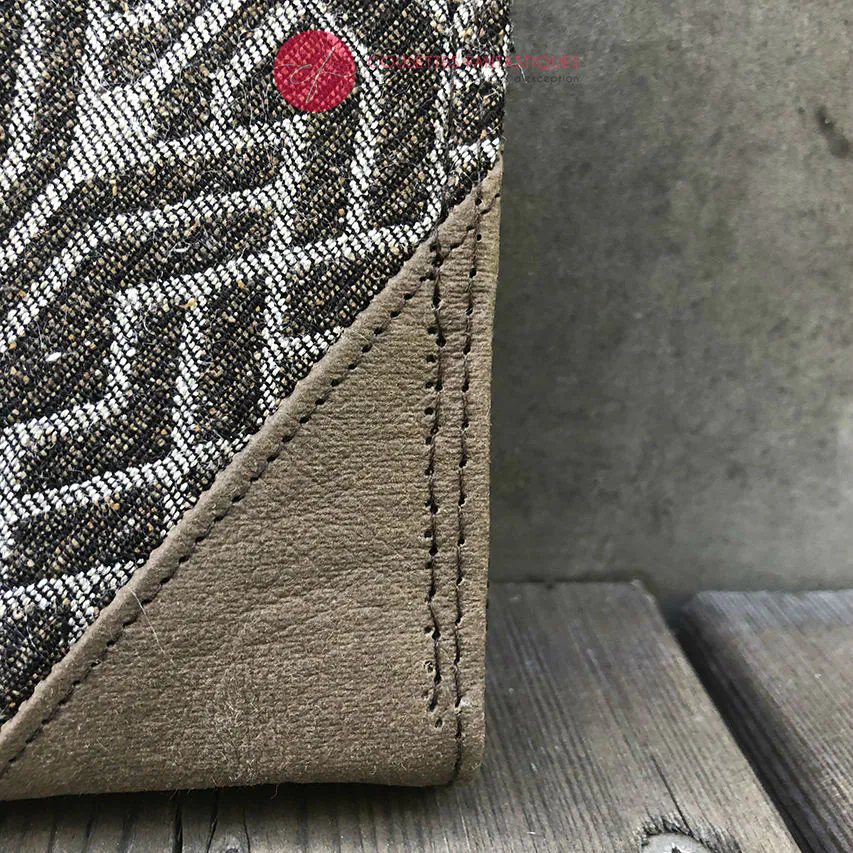 A zipped wallet and cardholder made of chocolate brown washable paper, baby wrap fabric in brown and beige tones, and yellow poplin.